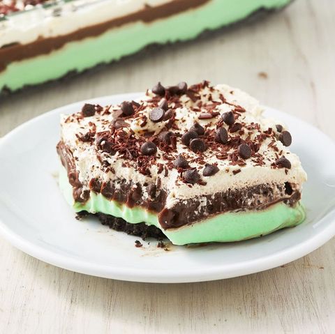square slice of mint chip lasagna with a bite out of it on a white plate