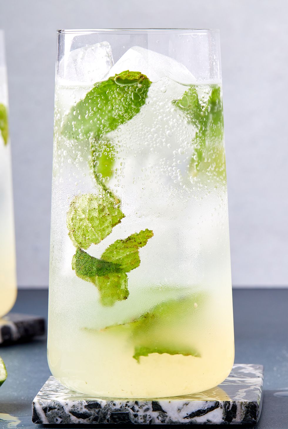 mojito cocktail with fresh lime juice and mint leaves