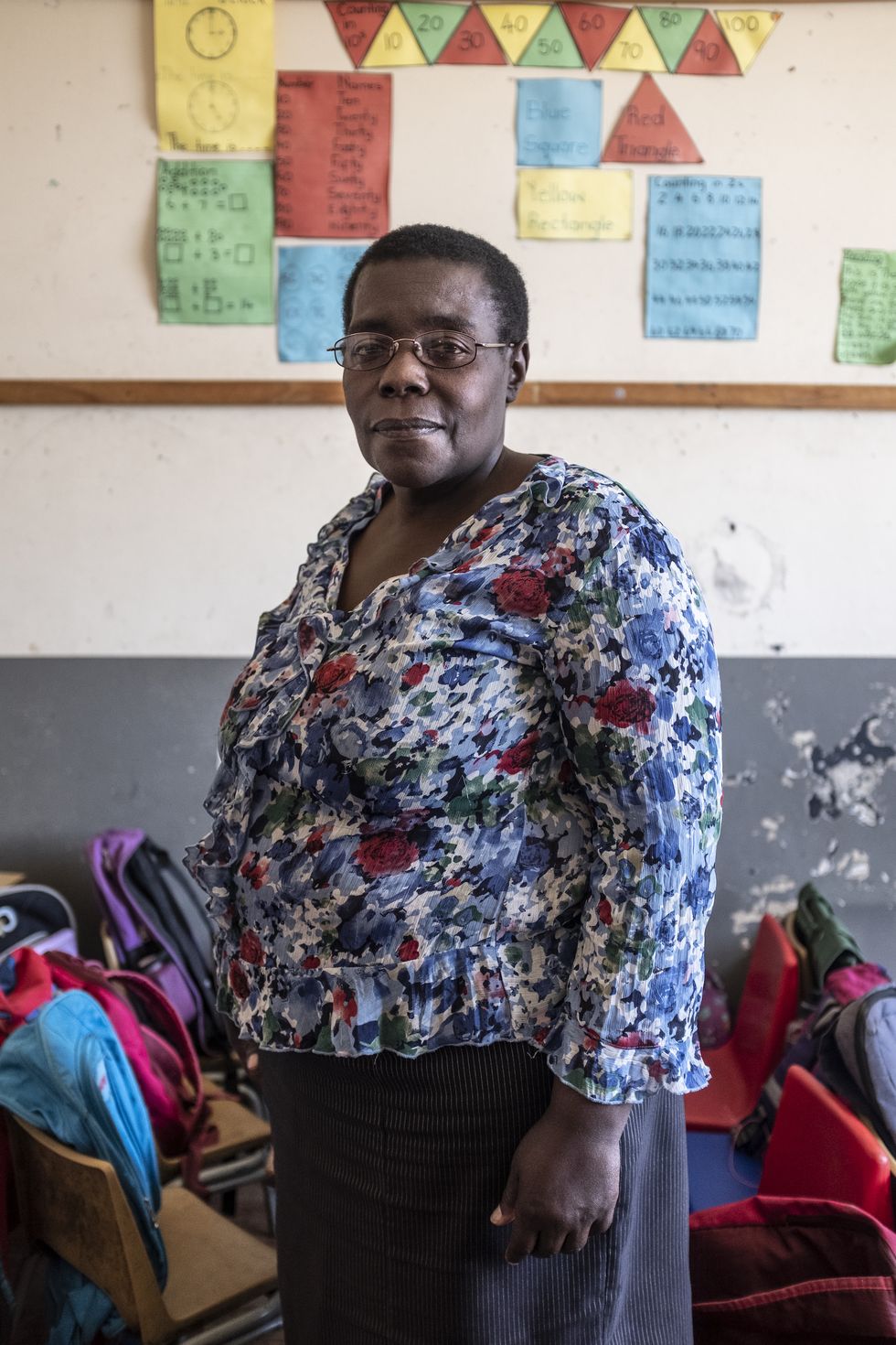 a portrait of judith manjoro, a zimbabwe migrant and former out of work teacher who founded a school for african migrant children in the suburb of yeoville in johannesburg  the school welcomes migrant children who were not admitted to south african public schools because are not able to furnish documents such as birth certificates or immunisation cards, or pay schools fees demanded by private schools 8 october 2019 johannesburg, south africa © miora rajaonary  national geographic
