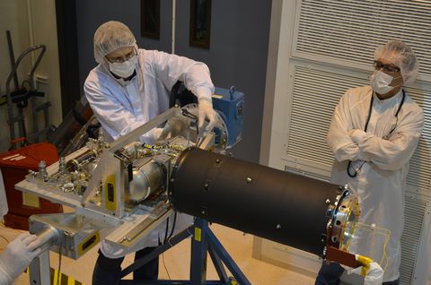 technicians inspect a component of the miri cryocooler part of nasa's james webb space telescope