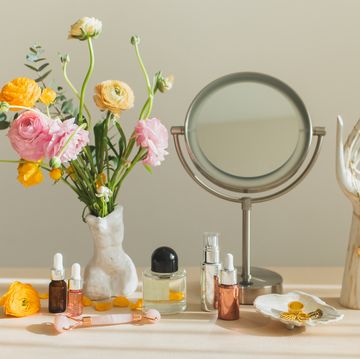 mirror and cosmetic products on female table at home