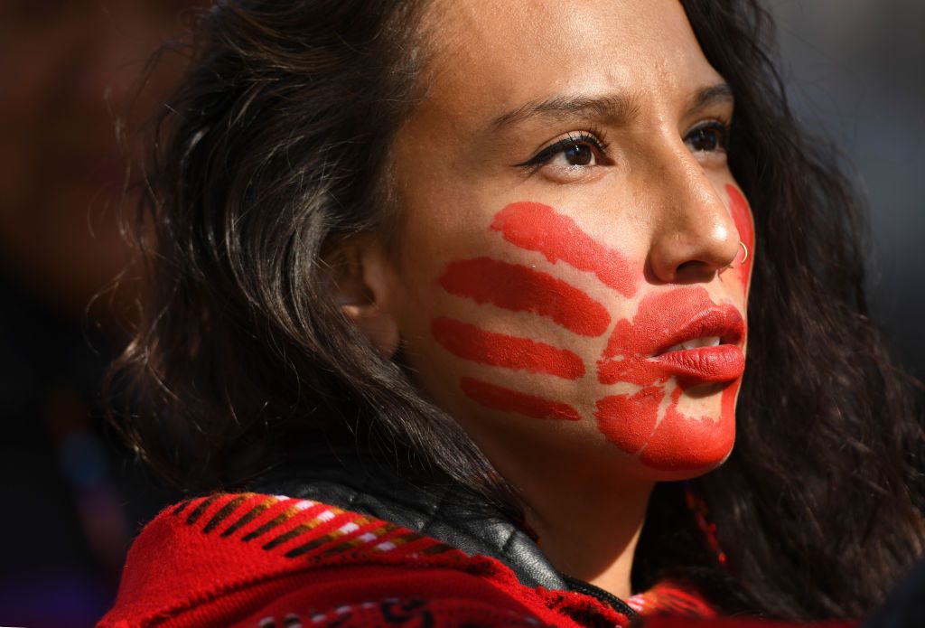 denver co   october 11 micaela iron shell has painted red hands over their mouth to show solidarity for missing and murdered indigenous, black and migrant women and children during a rally with climate activist greta thunberg at civic center park on october 11, 2019 in denver, colorado photo by rj sangostimedianews groupthe denver post via getty images
