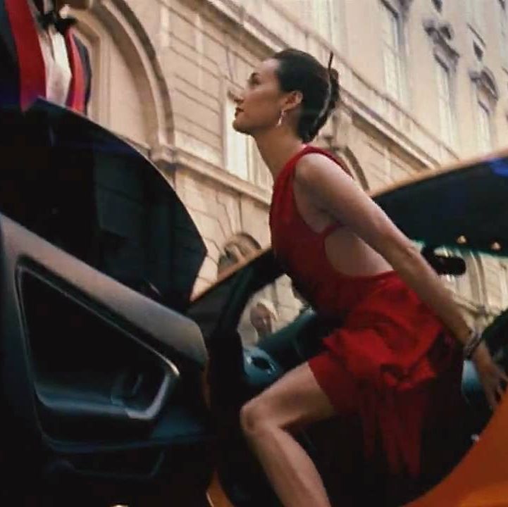 zhen lei exits a hot car in a hotter dress in a scene from mission impossible 3 it is the third film if you're watching the mission impossible movies in order
