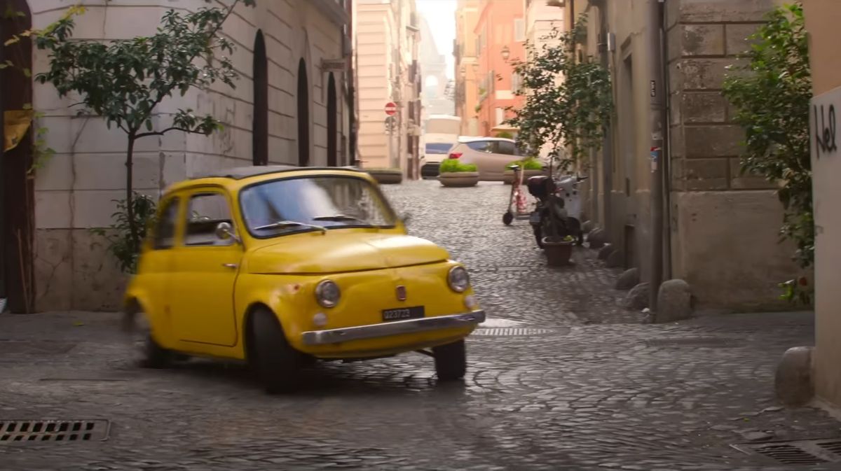 a yellow fiat 500 drifts over cobblestones in mission impossible dead reckoning part 1
