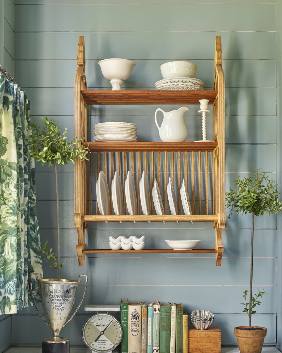 mississippi farmhouse wood plate rack in blue kitchen