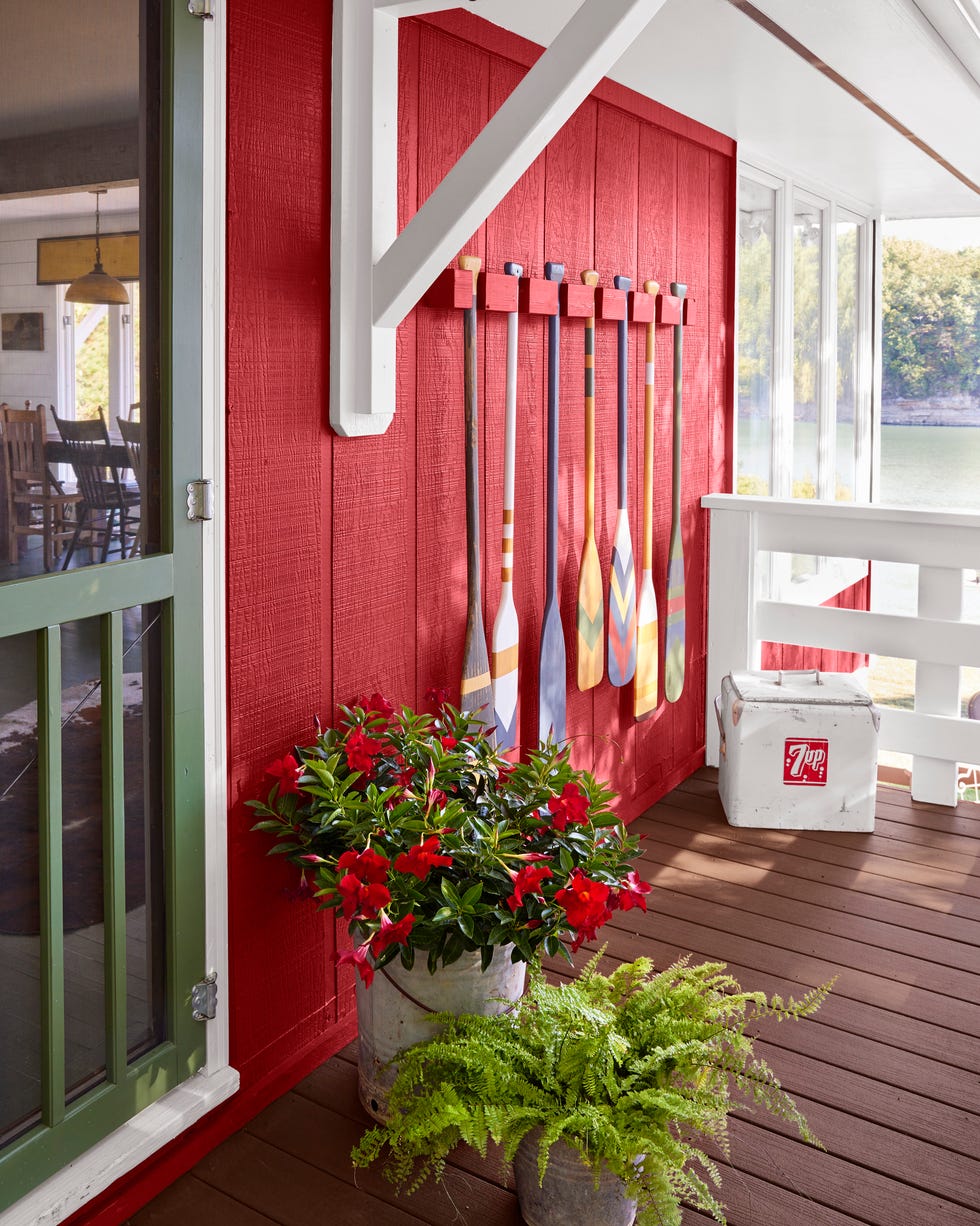 red lake cabin red lake cabin front porch with painted paddles hanging on the wall