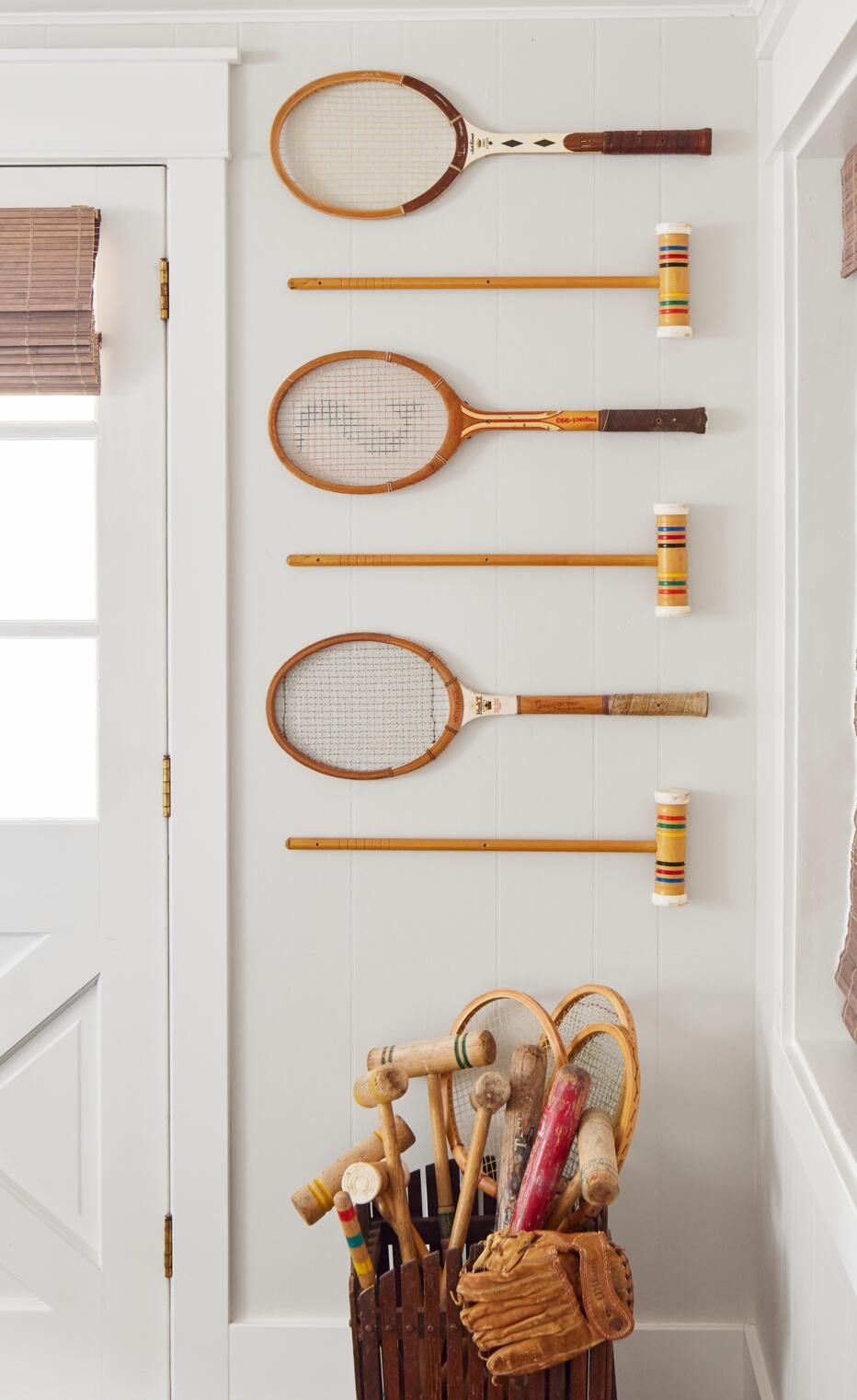 vintage tennis rackets and croquet mallets