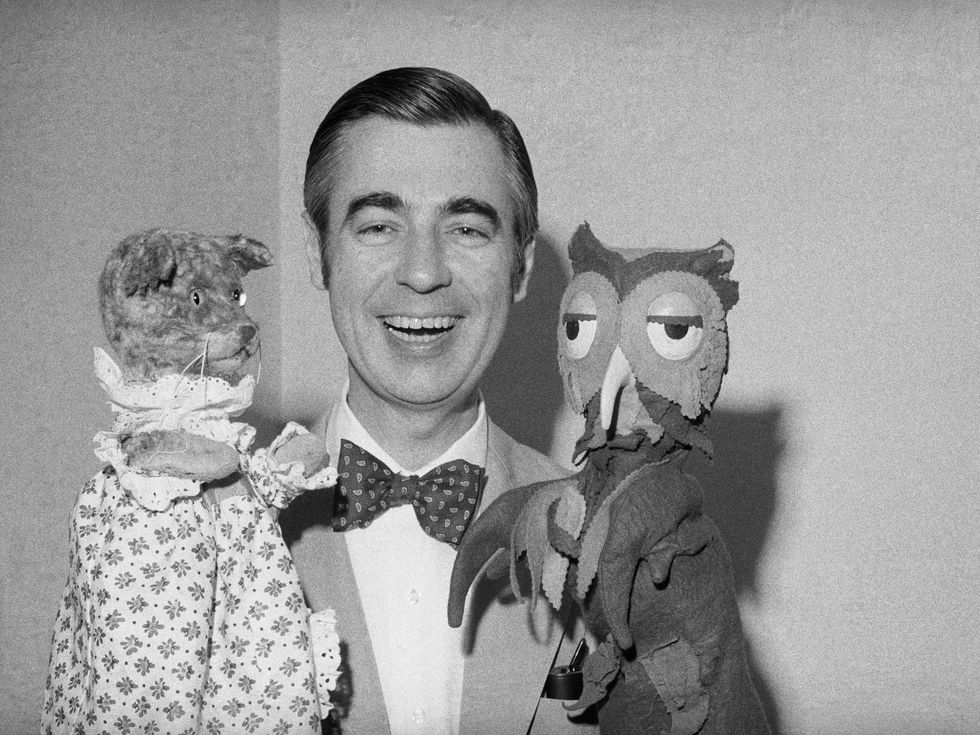 Mister Rogers holds Henrietta Pussycat and 'X' the Owl