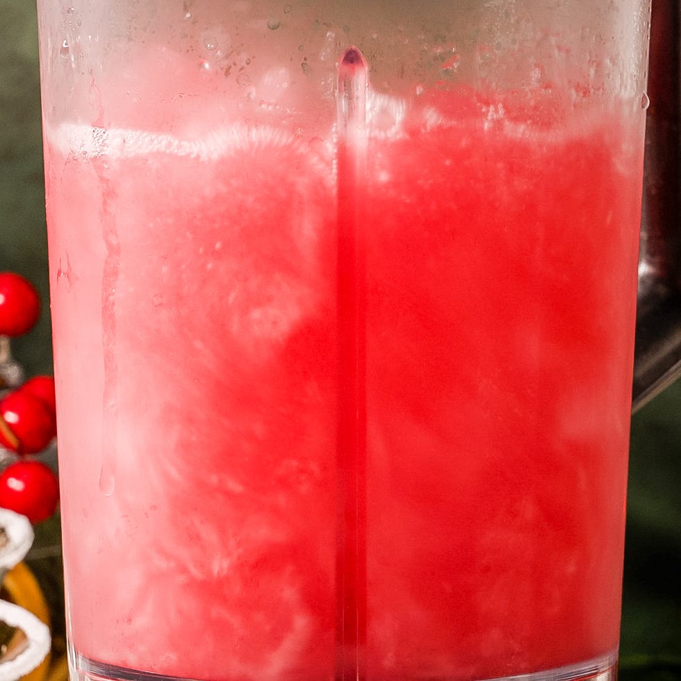 frosted red beverage in a pitcher with condensation
