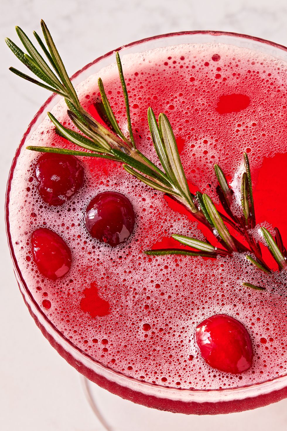mistletoe martini with cranberries and rosemary