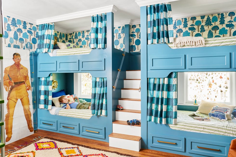 child's bedroom with blue train style bunk beds