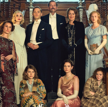 Mitford Family group portrait in elegant attire at a grand staircase