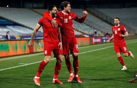 serbia's aleksandar mitrovic celebrates his goal with dusan vlahovic during the fifa world cup qatar 2022 qualification football match between serbia and ireland, at the rajko mitic stadium, in belgrade, serbia on march 24, 2021 photo by pedja milosavljevic  afp photo by pedja milosavljevicafp via getty images