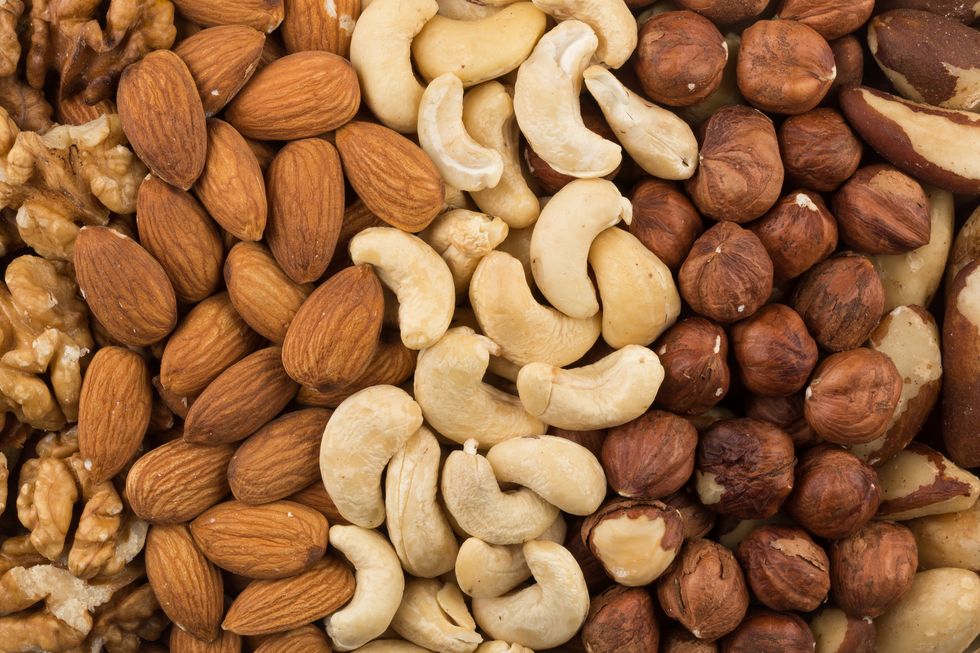 mixe of various nuts background above closeup