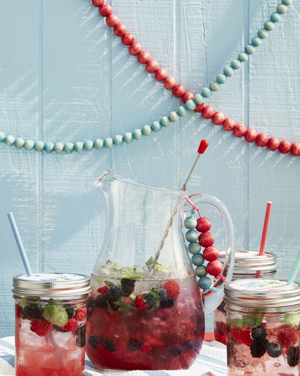 pitcher and glasses of berry spritzers with wood bead garlands