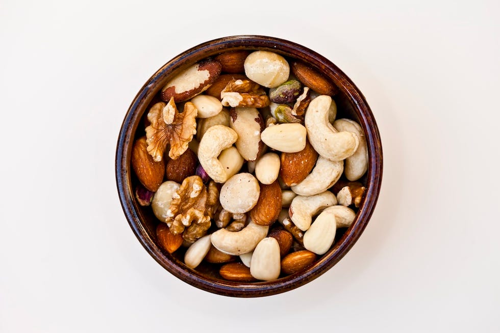 close up of a bowl of mixed raw nuts