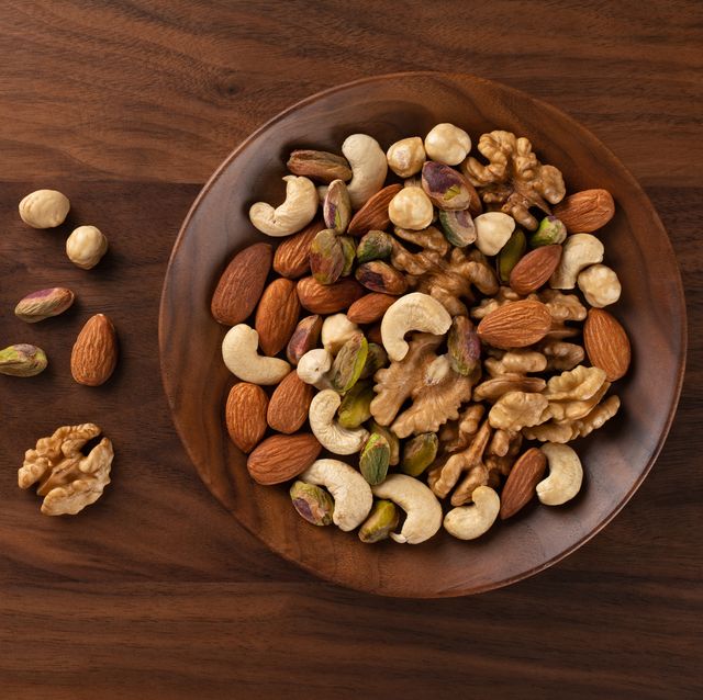 mixed nuts assortment in a wood bowl
