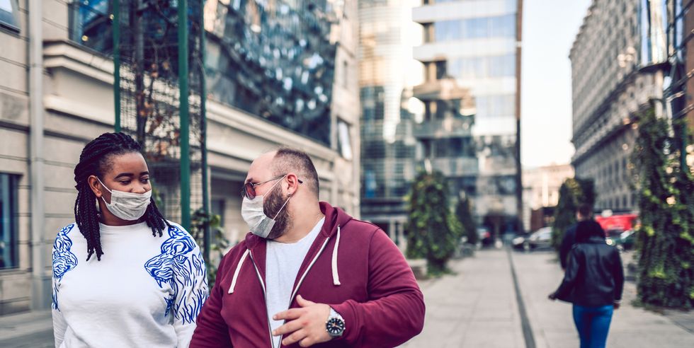 mixed race couple protesting against air pollution with masks