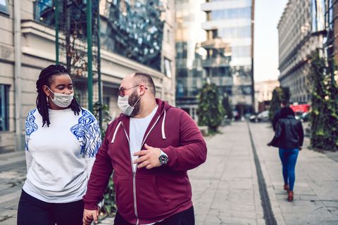 mixed race couple protesting against air pollution with masks