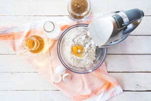 mixing flour and eggs with a table mixer