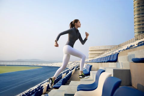 athlete running up stadium steps in activewear