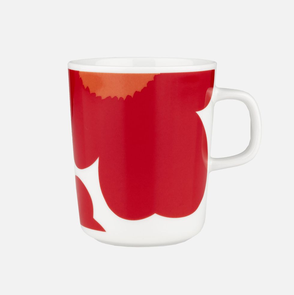 a red mug with a white handle