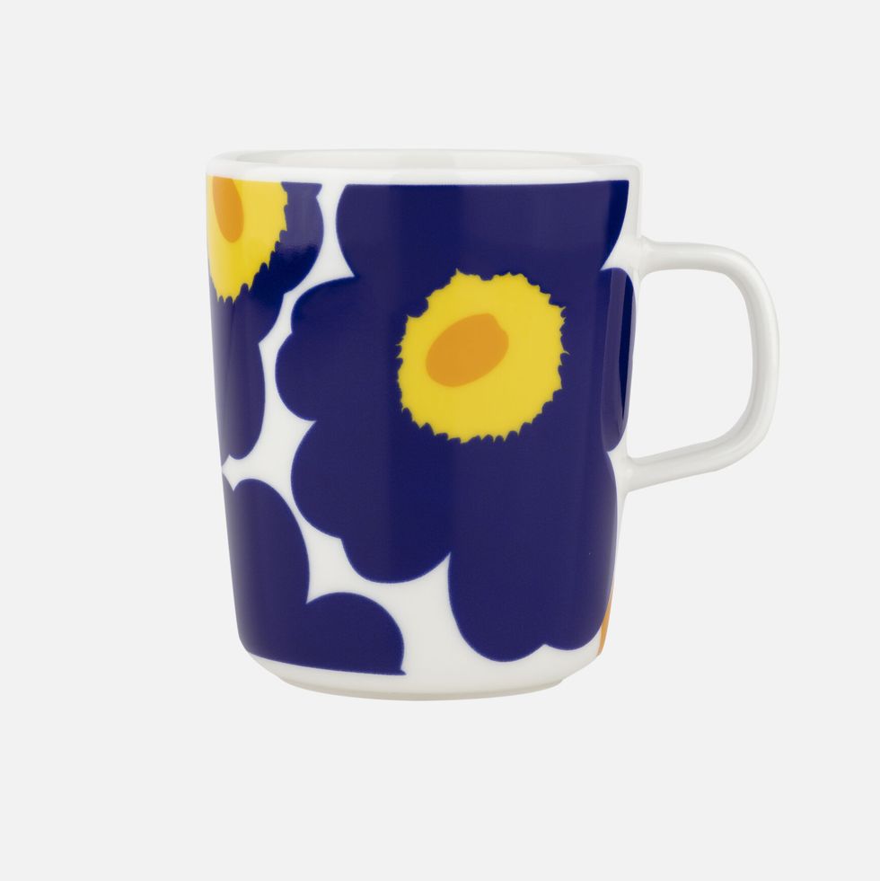 a white and blue coffee cup