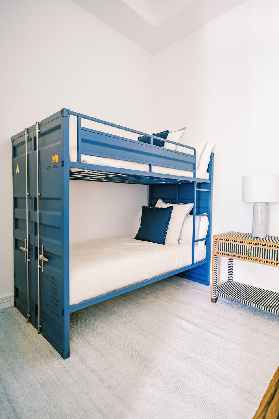 blue shipping container style bunk beds