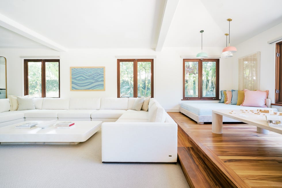large white u shaped sofa and cozy daybed area