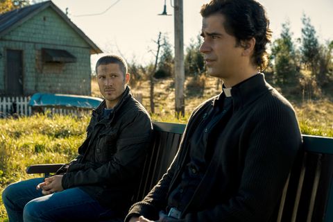 midnight mass l to r zach gilford as riley flynn and hamish linklater as father paul in episode 102 of midnight mass cr eike schroternetflix © 2021