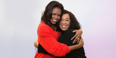 Former First Lady Michelle Obama hugs Shonda Rhimes