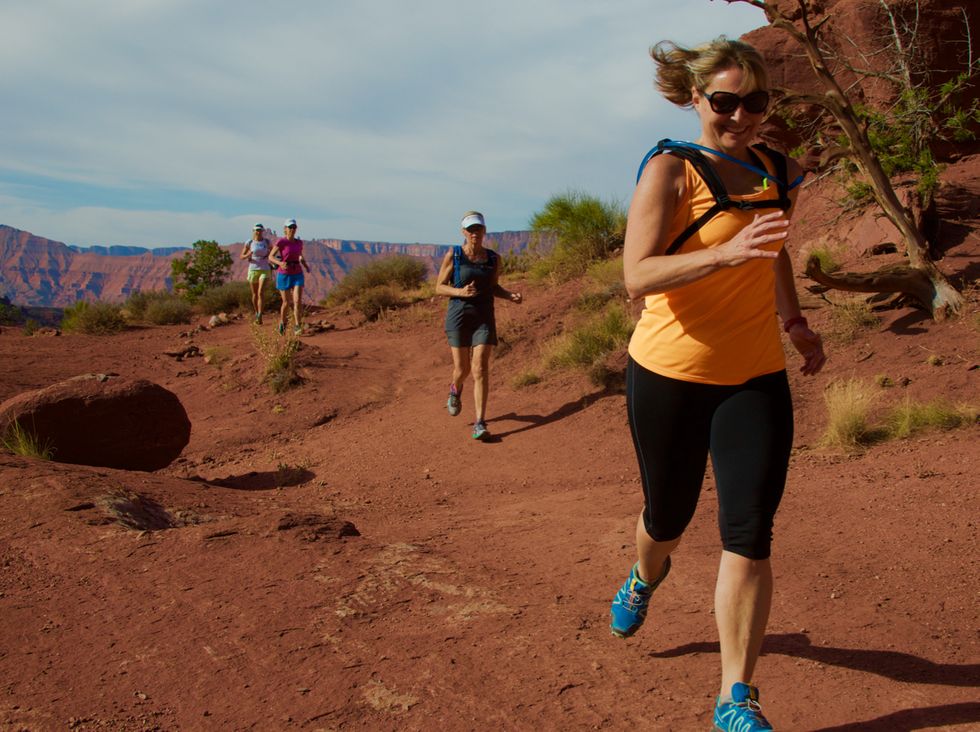 Runners along the trail in Moab on a Mindful Running Run Wild Retreat.