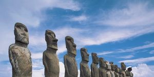 moai statues in a row, ahu tongariki, easter island, chile