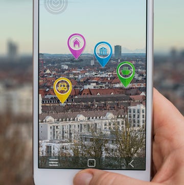 mobile phone displaying city with symbols