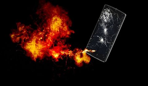 Mobile phone with broken glass exploding.