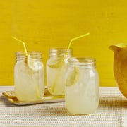 mocktail recipes lemonade in jars with straws yellow background