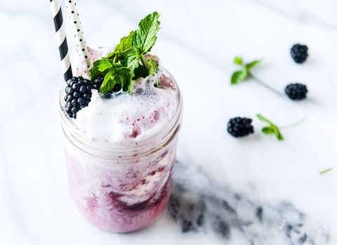 blackberry soda float in jar with straw and mint