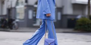 dusseldorf, germany   may 03 alexandra lapp wearing blue aggi blazer and trousers, white zara shirt, light blue bulgari serpenti forever bag and white converse chuck taylor sneakers on may 03, 2021 in dusseldorf, germany photo by jeremy moellergetty images