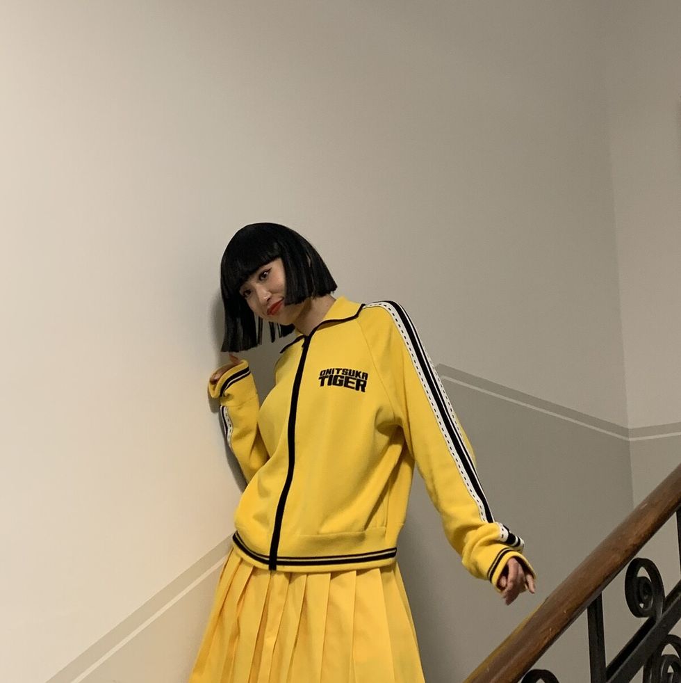 a person in a yellow raincoat