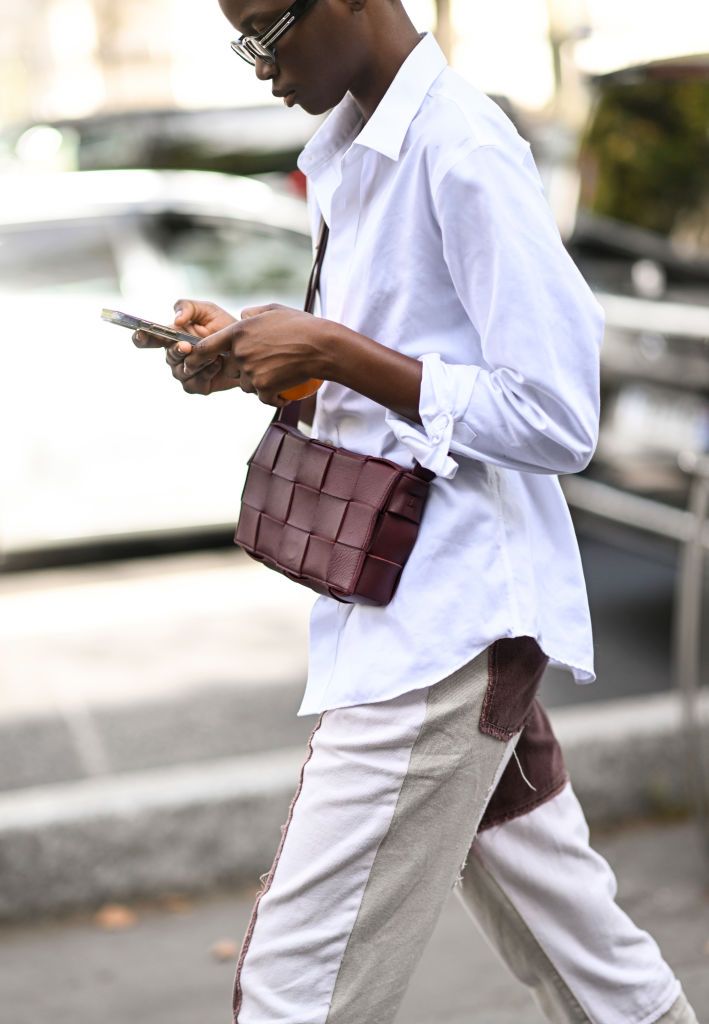 model is seen wearing a white button shirt cream and maroon news photo
