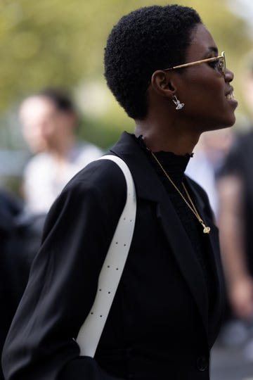 a model wears a black turtleneck in a guide to the best black turtlenecks for women of 2023