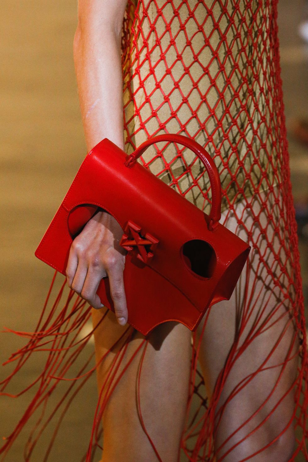 Off-White's Hole-Punctured Meteor Shower Jitney Handbag Debuts at Paris  Fashion Week