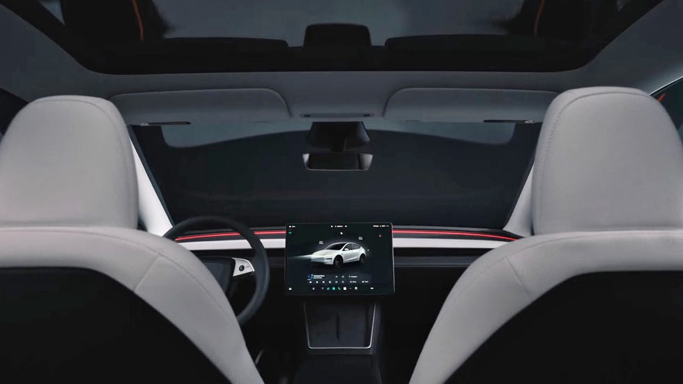 interior view of a modern electric vehicle featuring a touchscreen interface