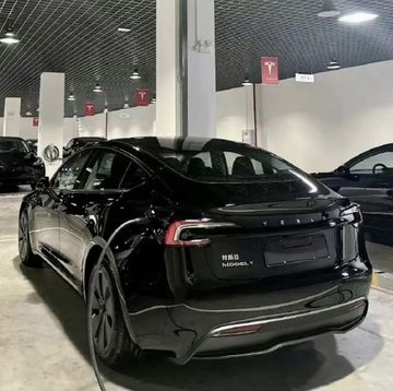 a black sports car parked in a showroom