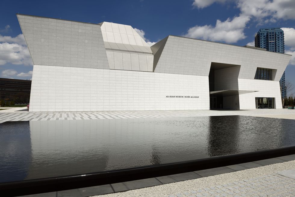 modern aga khan museum facade architecture with black pond toronto