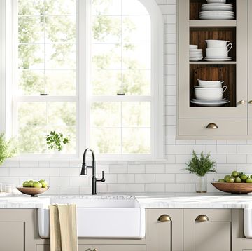 modern bright shaker style kitchen with belfast sink