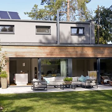 home energy tax credits 2024, modern detached house with terrace and garden