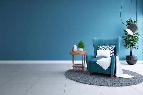 modern interior of living room,blueprint home decor concept ,blue sofa and black lamp