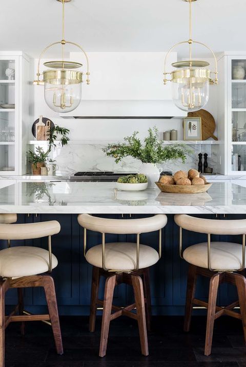 modern kitchen with navy island and white counters