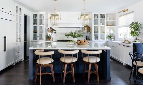 modern kitchen with navy island and white counters